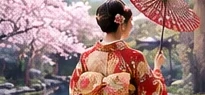 Woman in kimono with a red umbrella under cherry blossoms