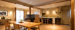 Spacious family room with kitchen and dining table
